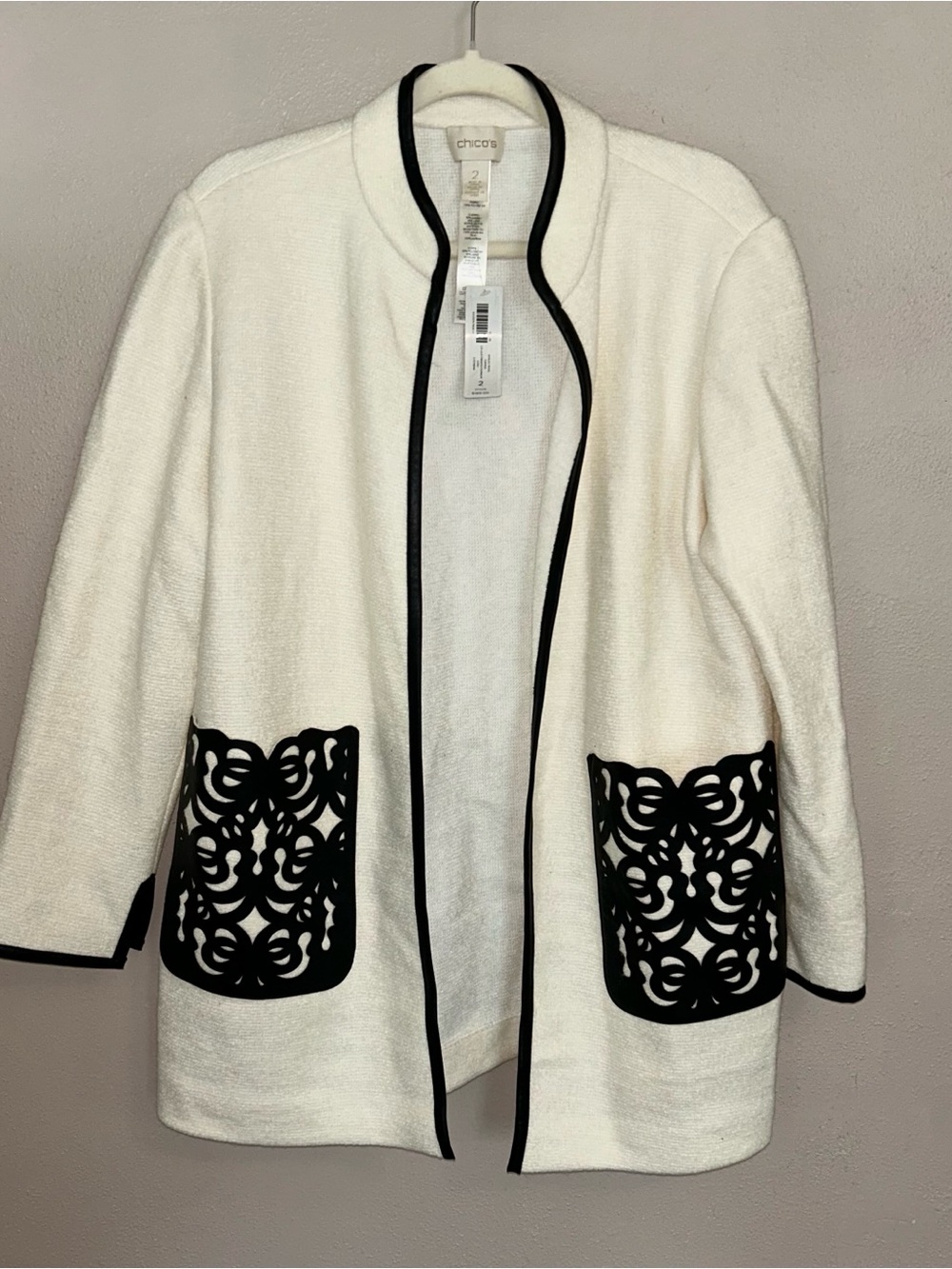 Chico's White Open-Front Jacket with Black Trim and Laser-Cut Pockets